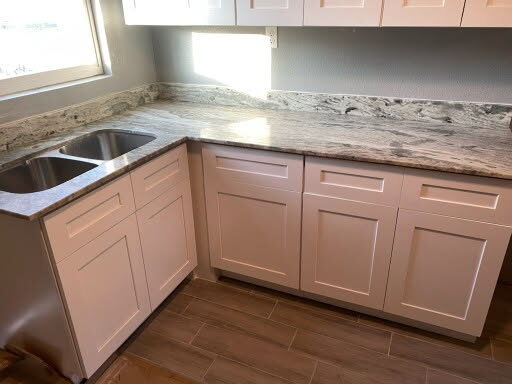 New shaker cabinets with granite countertop and double sink